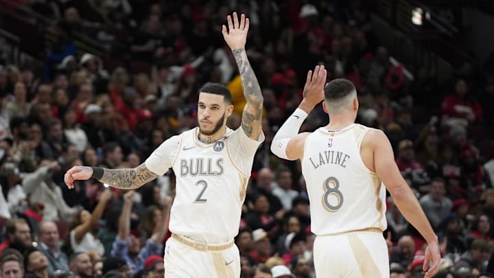 Jan 4, 2025; Chicago, Illinois, USA; Chicago Bulls guard Lonzo Ball (2) high fives guard Zach LaVine (8) after making a three point basket against the New York Knicks during the second half at United Center. Mandatory Credit: David Banks-Imagn Images