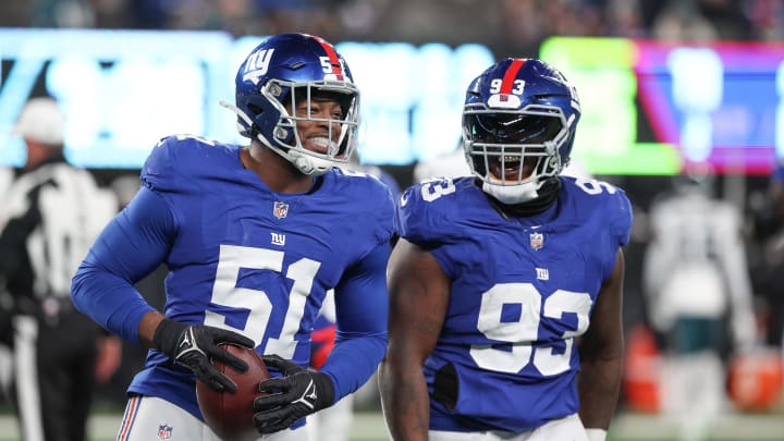 Jan 7, 2024; East Rutherford, New Jersey, USA; New York Giants linebacker Azeez Ojulari (51) celebrates with defensive tackle Rakeem Nunez-Roches (93) after recovering a fumble during the second half against the Philadelphia Eagles at MetLife Stadium. Mandatory Credit: Vincent Carchietta-USA TODAY Sports Jan 7, 2024; East Rutherford, New Jersey, USA; New York Giants linebacker Azeez Ojulari (51) celebrates with defensive tackle Rakeem Nunez-Roches (93) after recovering a fumble during the second half against the Philadelphia Eagles at MetLife Stadium. Mandatory Credit: Vincent Carchietta-USA TODAY Sports