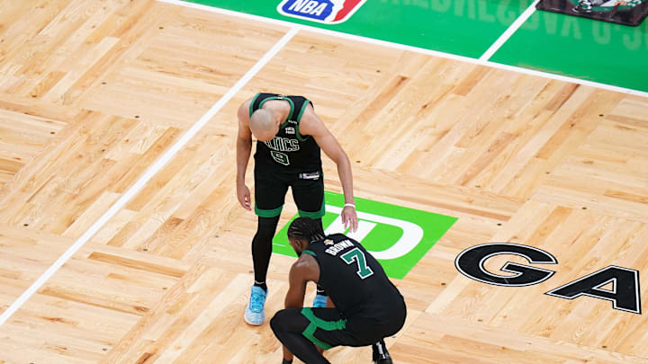 Jun 9, 2024; Boston, Massachusetts, USA; Boston Celtics guard Jaylen Brown (7) reacts with guard Derrick White (9) after defeating the Dallas Mavericks in game two of the 2024 NBA Finals at TD Garden. Mandatory Credit: David Butler II-Imagn Images