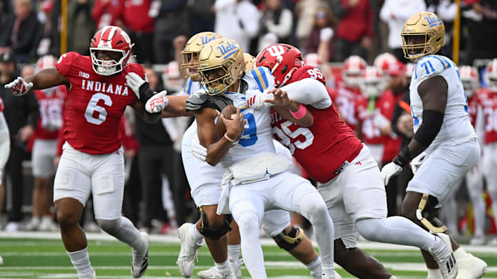 Oct 25, 2025; Bloomington, Indiana, USA; Indiana Hoosiers defensive lineman Tyrique Tucker (95) brings down UCLA Bruins quarterback Nico Iamaleava (9) during the first half at Memorial Stadium. Mandatory Credit: Robert Goddin-Imagn Images Oct 25, 2025; Bloomington, Indiana, USA; Indiana Hoosiers defensive lineman Tyrique Tucker (95) brings down UCLA Bruins quarterback Nico Iamaleava (9) during the first half at Memorial Stadium. Mandatory Credit: Robert Goddin-Imagn Images
