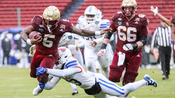 Boston College's Kye Robichaux carries the ball during the second annual Wasabi Fenway Bowl vs. SMU at Fenway Park on Thursday, Dec. 28, 2023.