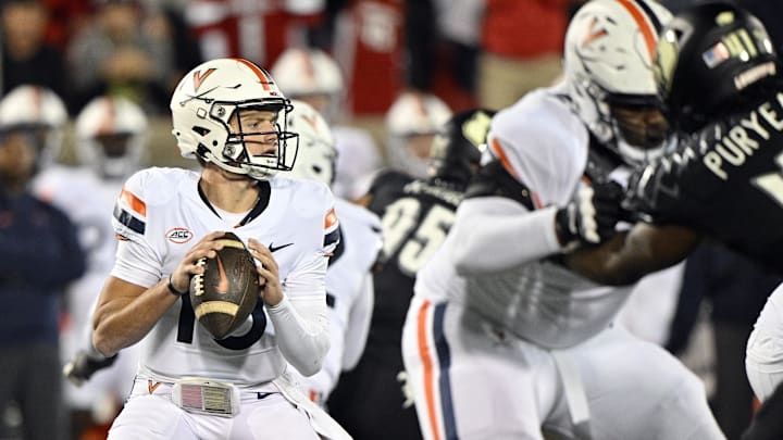 Nov 9, 2023; Louisville, Kentucky, USA; Virginia Cavaliers quarterback Anthony Colandrea (10) looks to pass against the Louisville Cardinals during the first half at L&N Federal Credit Union Stadium. Louisville defeated Virginia 31-24. Mandatory Credit: Jamie Rhodes-Imagn Images