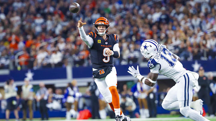Dec 9, 2024; Arlington, Texas, USA;  Cincinnati Bengals quarterback Joe Burrow (9) throws as Dallas Cowboys linebacker DeMarvion Overshown (13) defends during the first half at AT&T Stadium. Mandatory Credit: Kevin Jairaj-Imagn Images