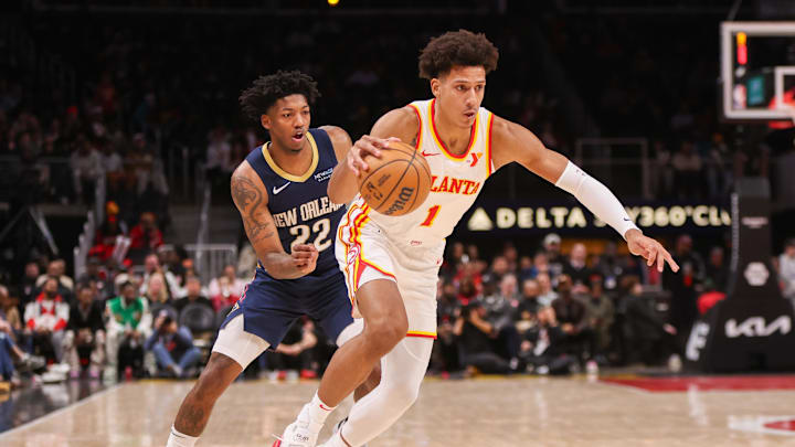 Dec 2, 2024; Atlanta, Georgia, USA; Atlanta Hawks forward Jalen Johnson (1) drives past New Orleans Pelicans guard Elfrid Payton (22) in the second quarter at State Farm Arena. Mandatory Credit: Brett Davis-Imagn Images Dec 2, 2024; Atlanta, Georgia, USA; Atlanta Hawks forward Jalen Johnson (1) drives past New Orleans Pelicans guard Elfrid Payton (22) in the second quarter at State Farm Arena. Mandatory Credit: Brett Davis-Imagn Images
