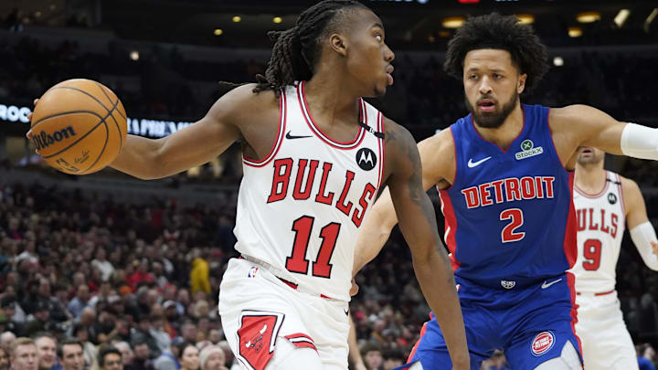 Feb 11, 2025; Chicago, Illinois, USA; Detroit Pistons guard Cade Cunningham (2) defends Chicago Bulls guard Ayo Dosunmu (11) during the first quarter at United Center. Mandatory Credit: David Banks-Imagn Images