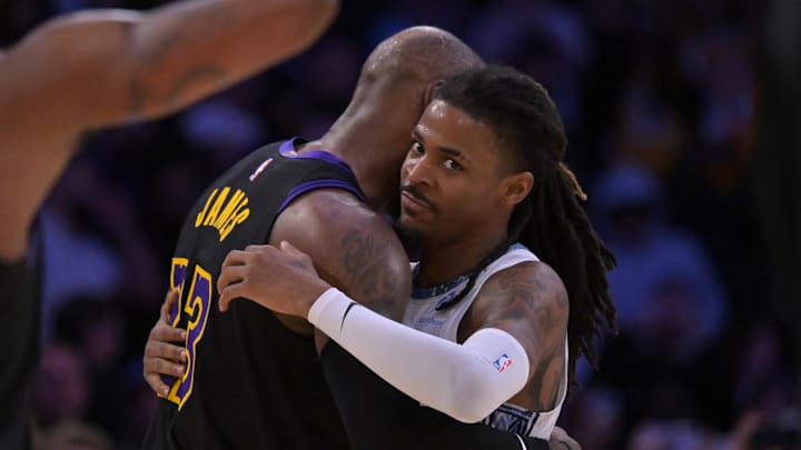 Jan 2, 2026; Los Angeles, California, USA; Los Angeles Lakers forward LeBron James (23) and Memphis Grizzlies guard Ja Morant (12) embrace following the game at Crypto.com Arena. Mandatory Credit: Jayne Kamin-Oncea-Imagn Images Jan 2, 2026; Los Angeles, California, USA; Los Angeles Lakers forward LeBron James (23) and Memphis Grizzlies guard Ja Morant (12) embrace following the game at Crypto.com Arena. Mandatory Credit: Jayne Kamin-Oncea-Imagn Images