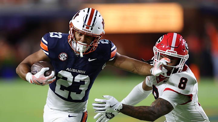 Jeremiah Cobb stiff-arms Joenel Aguero