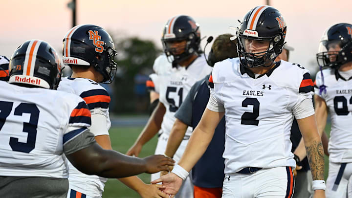 Nashville Christian quarterback Jared Curtis (2) is congratulated after playing the first quarter against Franklin Road Academy during an high school football scrimmage Friday, Aug. 16, 2024, in Nashville, Tenn.