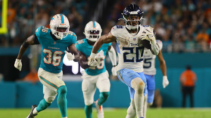 Sep 30, 2024; Miami Gardens, Florida, USA; Tennessee Titans running back Tony Pollard (20) runs with the football against the Miami Dolphins during the third quarter at Hard Rock Stadium. Mandatory Credit: Sam Navarro-Imagn Images