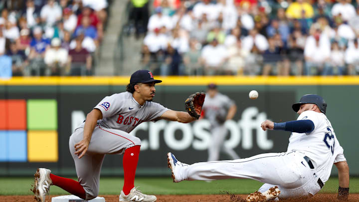 Seattle Mariners first baseman Rowdy Tellez (23) steals a base against Boston Red Sox second baseman David Hamilton (17) during the second inning at T-Mobile Park on June 17. Seattle Mariners first baseman Rowdy Tellez (23) steals a base against Boston Red Sox second baseman David Hamilton (17) during the second inning at T-Mobile Park on June 17.