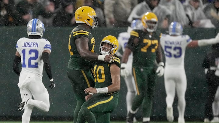 Green Bay Packers quarterback Jordan Love (10) gets up after throwing his pick-six against the Detroit Lions.