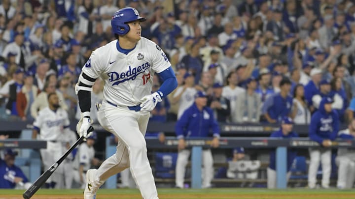 Oct 25, 2024; Los Angeles, California, USA; Los Angeles Dodgers designated hitter player Shohei Ohtani (17) hits a double in the eighth inning against the New York Yankees during game one of the 2024 MLB World Series at Dodger Stadium. Mandatory Credit:  Jayne Kamin-Oncea-Imagn Images
