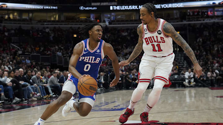 Mar 22, 2023; Chicago, Illinois, USA; Chicago Bulls forward DeMar DeRozan (11) defends Philadelphia 76ers guard Tyrese Maxey (0) during the second half at United Center. Mandatory Credit: David Banks-Imagn Images