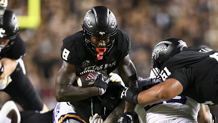 Oct 26, 2024; College Station, Texas, USA; Texas A&M Aggies running back Le'Veon Moss (8) runs the ball during the first quarter against the LSU Tiger. The Aggies defeated the Tigers 38-23; at Kyle Field. Mandatory Credit: Maria Lysaker-Imagn Images.  