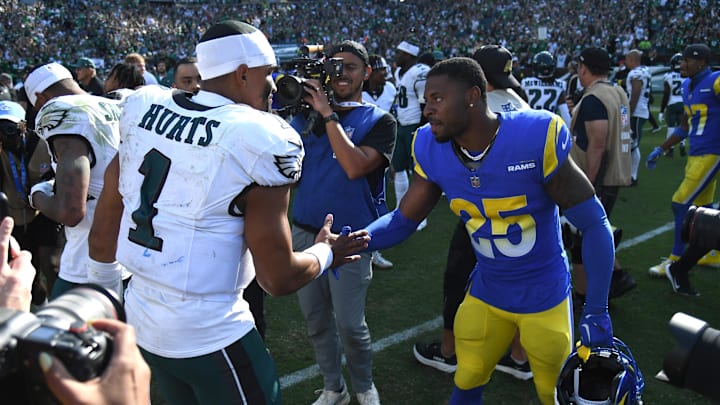 Sep 21, 2025; Philadelphia, Pennsylvania, USA; Philadelphia Eagles quarterback Jalen Hurts (1) and Los Angeles Rams cornerback Emmanuel Forbes (25) meet on the field after the game at Lincoln Financial Field. Mandatory Credit: Eric Hartline-Imagn Images Sep 21, 2025; Philadelphia, Pennsylvania, USA; Philadelphia Eagles quarterback Jalen Hurts (1) and Los Angeles Rams cornerback Emmanuel Forbes (25) meet on the field after the game at Lincoln Financial Field. Mandatory Credit: Eric Hartline-Imagn Images