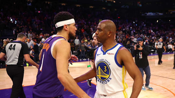 Dec 12, 2023; Phoenix, Arizona, USA; Golden State Warriors guard Chris Paul (3) greets Phoenix Suns guard Devin Booker (1) following the game at Footprint Center. Mandatory Credit: Mark J. Rebilas-USA TODAY Sports Dec 12, 2023; Phoenix, Arizona, USA; Golden State Warriors guard Chris Paul (3) greets Phoenix Suns guard Devin Booker (1) following the game at Footprint Center. Mandatory Credit: Mark J. Rebilas-USA TODAY Sports