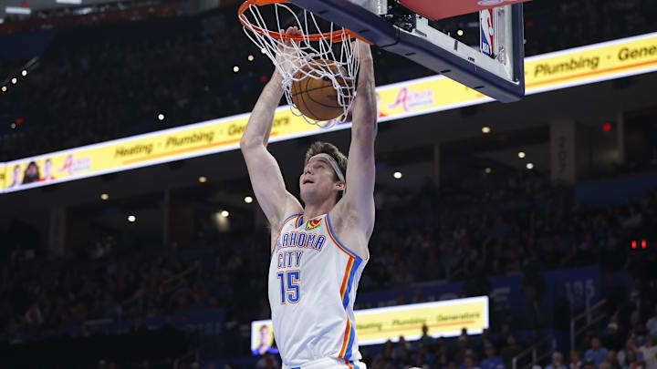 Oct 28, 2025; Oklahoma City, Oklahoma, USA; Oklahoma City Thunder center Branden Carlson (15) dunks against the Sacramento Kings during the second half at Paycom Center. Mandatory Credit: Alonzo Adams-Imagn Images