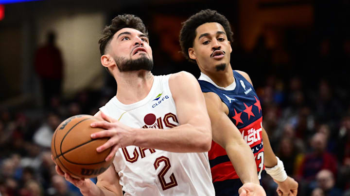 Dec 13, 2024; Cleveland, Ohio, USA; Cleveland Cavaliers guard Ty Jerome (2) drives to the basket against Washington Wizards guard Jordan Poole (13) during the second half at Rocket Mortgage FieldHouse. Mandatory Credit: Ken Blaze-Imagn Images