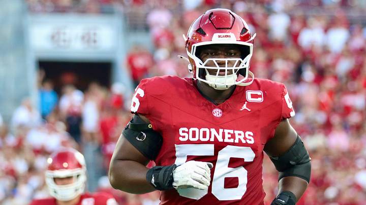 Oklahoma offensive lineman Michael Fasusi runs onto the field before the Sooners' game against New Mexico. Oklahoma offensive lineman Michael Fasusi runs onto the field before the Sooners' game against New Mexico.