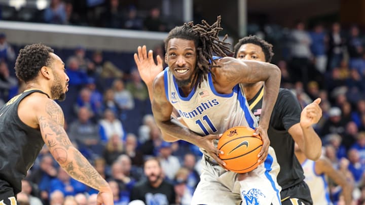 Dec 17, 2025; Memphis, Tennessee, USA; Memphis Tigers forward Aaron Bradshaw (11) drives against the Vanderbilt Commodores during the second half at FedExForum. Mandatory Credit: Wesley Hale-Imagn Images
