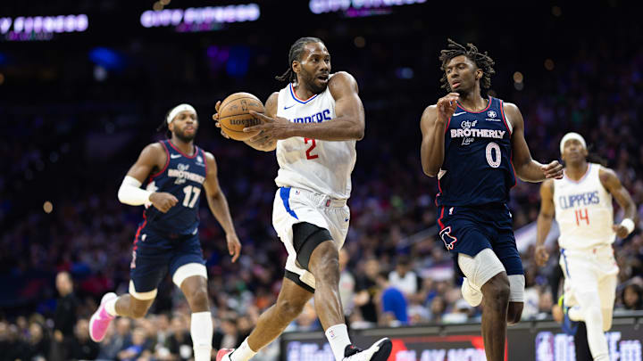 Mar 27, 2024; Philadelphia, Pennsylvania, USA; LA Clippers forward Kawhi Leonard (2) drives for a shot against Philadelphia 76ers guard Tyrese Maxey (0) during the third quarter at Wells Fargo Center. Mandatory Credit: Bill Streicher-Imagn Images
