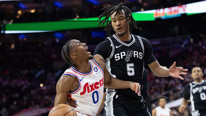 Dec 23, 2024; Philadelphia, Pennsylvania, USA; Philadelphia 76ers guard Tyrese Maxey (0) drives against San Antonio Spurs guard Stephon Castle (5) during the second quarter at Wells Fargo Center. Mandatory Credit: Bill Streicher-Imagn Images Dec 23, 2024; Philadelphia, Pennsylvania, USA; Philadelphia 76ers guard Tyrese Maxey (0) drives against San Antonio Spurs guard Stephon Castle (5) during the second quarter at Wells Fargo Center. Mandatory Credit: Bill Streicher-Imagn Images