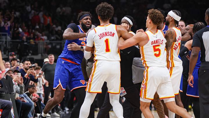 Apr 30, 2026; Atlanta, Georgia, USA; New York Knicks center Mitchell Robinson (23) is held back by security during an altercation with Atlanta Hawks guard Dyson Daniels (5) in the second quarter during game six of the first round of the 2026 NBA Playoffs at State Farm Arena. Mandatory Credit: Brett Davis-Imagn Images Apr 30, 2026; Atlanta, Georgia, USA; New York Knicks center Mitchell Robinson (23) is held back by security during an altercation with Atlanta Hawks guard Dyson Daniels (5) in the second quarter during game six of the first round of the 2026 NBA Playoffs at State Farm Arena. Mandatory Credit: Brett Davis-Imagn Images