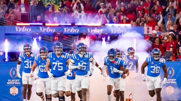 Mississippi Rebels players run onto the field prior to the game against the Miami Hurricanes 