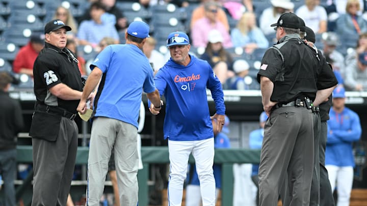 Jun 19, 2024; Omaha, NE, USA;  Florida Gators head coach Kevin O'Sullivan greets Kentucky Wildcats head coach Nick Mingione before the game at Charles Schwab Field Omaha. Mandatory Credit: Steven Branscombe-Imagn Images