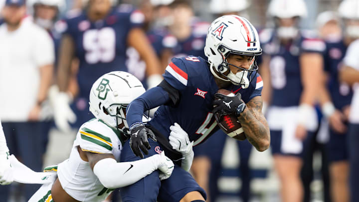 Nov 22, 2025; Tucson, Arizona, USA; Arizona Wildcats wide receiver Kris Hutson (4) against the Baylor Bears in the first half at Casino Del Sol Stadium. Mandatory Credit: Mark J. Rebilas-Imagn Images