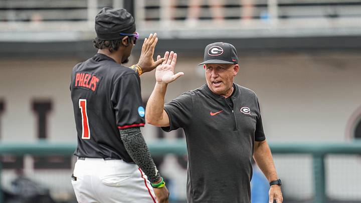 May 29, 2026; Athens, GA, USA; Georgia Bulldogs head coach Wes Johnson reacts with Georgia Bulldogs infielder Tre Phelps (1) on the field prior to the game against the LIU Sharks at Foley Field. Mandatory Credit: Dale Zanine-Imagn Images May 29, 2026; Athens, GA, USA; Georgia Bulldogs head coach Wes Johnson reacts with Georgia Bulldogs infielder Tre Phelps (1) on the field prior to the game against the LIU Sharks at Foley Field. Mandatory Credit: Dale Zanine-Imagn Images