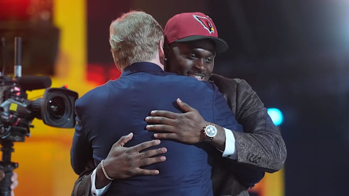 Apr 23, 2026; Pittsburgh, PA, USA; Notre Dame Fighting Irish running back Jeremiyah Love embraces NFL commissioner Roger Goodell after he is selected by the Arizona Cardinals as the number three pick during the 2026 NFL Draft at Acrisure Stadium. Mandatory Credit: Kirby Lee-Imagn Images