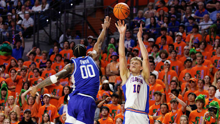 Florida beat Kentucky, 92-83, for its first win at home over the Wildcats in eight years.