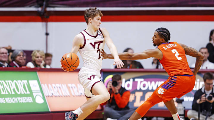 Jan 25, 2025; Blacksburg, Virginia, USA; Virginia Tech Hokies guard Jaden Schutt (2) controls the ball as Clemson Tigers guard Dillon Hunter (2) defends during the first half at Cassell Coliseum. Mandatory Credit: Peter Casey-Imagn Images Jan 25, 2025; Blacksburg, Virginia, USA; Virginia Tech Hokies guard Jaden Schutt (2) controls the ball as Clemson Tigers guard Dillon Hunter (2) defends during the first half at Cassell Coliseum. Mandatory Credit: Peter Casey-Imagn Images