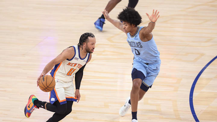 Nov 11, 2025; New York, New York, USA;  New York Knicks guard Jalen Brunson (11) looks to drive past Memphis Grizzlies forward Jaylen Wells (0) in the first quarter at Madison Square Garden. Mandatory Credit: Wendell Cruz-Imagn Images