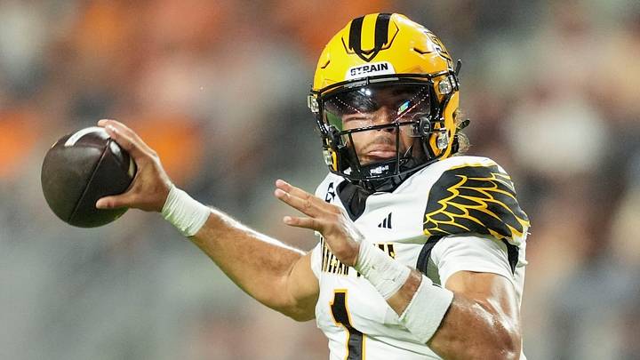 Kennesaw State quarterback Rickie Collins (1) drops back to pass during a college football game against Tennessee on Sept. 19, 2026, in Knoxville, Tennessee. Kennesaw State quarterback Rickie Collins (1) drops back to pass during a college football game against Tennessee on Sept. 19, 2026, in Knoxville, Tennessee.