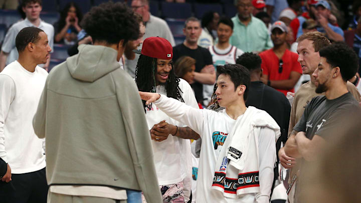 Apr 13, 2025; Memphis, Tennessee, USA; Memphis Grizzlies guard Yuki Kawamura (right middle) talks with forward Jaylen Wells (left), guard Ja Morant (left middle) and guard Scotty Pippen Jr. (right) at FedExForum. Mandatory Credit: Petre Thomas-Imagn Images