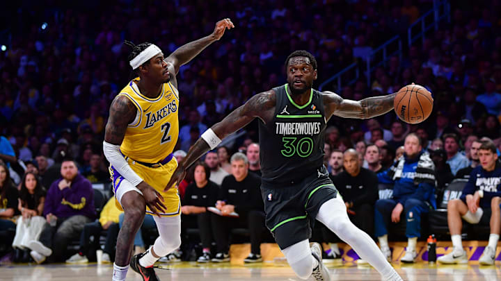 Apr 30, 2025; Los Angeles, California, USA; Minnesota Timberwolves forward Julius Randle (30) moves the ball against Los Angeles Lakers forward Jarred Vanderbilt (2) during the second half in game five of first round for the 2025 NBA Playoffs at Crypto.com Arena. Mandatory Credit: Gary A. Vasquez-Imagn Images