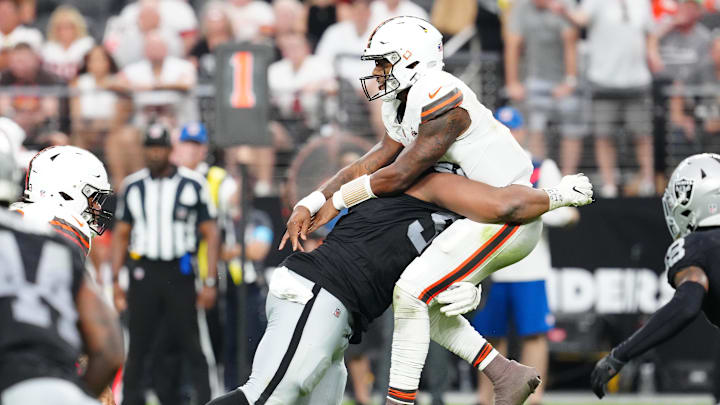 Las Vegas Raiders defensive tackle Christian Wilkins (94) hits Cleveland Browns quarterback Deshaun Watson (4) during the fourth quarter at Allegiant Stadium.