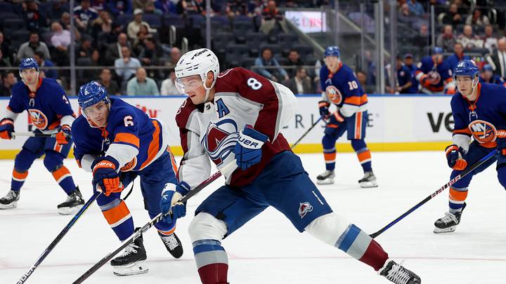 Oct 24, 2023; Elmont, New York, USA; Colorado Avalanche defenseman Cale Makar (8) shoots and scores on a backhanded shot against New York Islanders defenseman Ryan Pulock (6) during the first period at UBS Arena. Mandatory Credit: Brad Penner-USA TODAY Sports Oct 24, 2023; Elmont, New York, USA; Colorado Avalanche defenseman Cale Makar (8) shoots and scores on a backhanded shot against New York Islanders defenseman Ryan Pulock (6) during the first period at UBS Arena. Mandatory Credit: Brad Penner-USA TODAY Sports