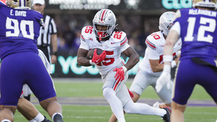 Sep 27, 2025; Seattle, Washington, USA; Ohio State Buckeyes running back Bo Jackson (25) rushes against the Washington Huskies during the fourth quarter at Husky Stadium. Mandatory Credit: Joe Nicholson-Imagn Images