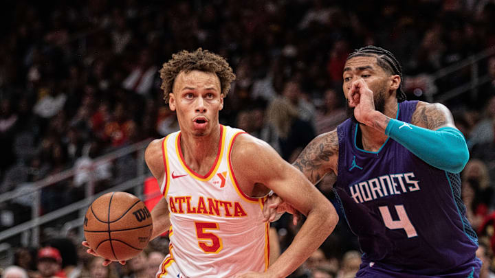 Oct 25, 2024; Atlanta, Georgia, USA; Atlanta Hawks guard Dyson Daniels (5) drives the ball against Charlotte Hornets center Nick Richards (4) during the fourth quarter at State Farm Arena. Mandatory Credit: Jordan Godfree-Imagn Images