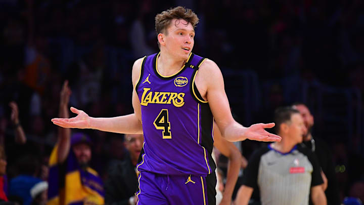 Nov 19, 2024; Los Angeles, California, USA; Los Angeles Lakers guard Dalton Knecht (4) react after scoring a three point basket against the Utah Jazz during the second half at Crypto.com Arena. Mandatory Credit: Gary A. Vasquez-Imagn Images Nov 19, 2024; Los Angeles, California, USA; Los Angeles Lakers guard Dalton Knecht (4) react after scoring a three point basket against the Utah Jazz during the second half at Crypto.com Arena. Mandatory Credit: Gary A. Vasquez-Imagn Images