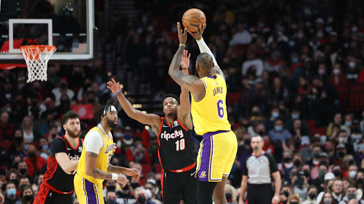 Feb 9, 2022; Portland, Oregon, USA;  Los Angeles Lakers forward LeBron James (6) shoots over Portland Trail Blazers guard Dennis Smith Jr. (10) in the second half at Moda Center. Mandatory Credit: Jaime Valdez-Imagn Images