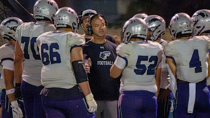 Franklin head football coach Ruben Torres talks to the team after taking the field following a lightning delay in the Cougars’ season opener against Chapin on Thursday, Aug. 28, 2025, at Irvin High School in El Paso, Texas.