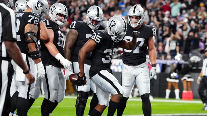 Dec 14, 2023; Paradise, Nevada, USA; Las Vegas Raiders running back Zamir White (35) celebrates after scoring a touchdown against the Los Angeles Chargers in the first quarter at Allegiant Stadium. Mandatory Credit: Stephen R. Sylvanie-USA TODAY Sports Dec 14, 2023; Paradise, Nevada, USA; Las Vegas Raiders running back Zamir White (35) celebrates after scoring a touchdown against the Los Angeles Chargers in the first quarter at Allegiant Stadium. Mandatory Credit: Stephen R. Sylvanie-USA TODAY Sports