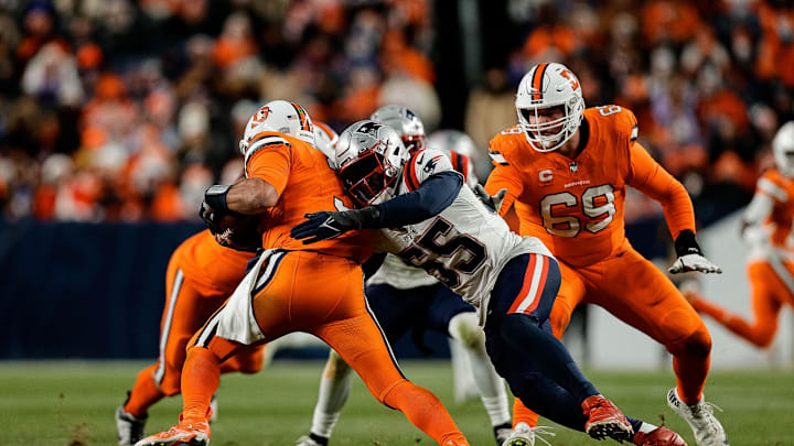 Dec 24, 2023; Denver, Colorado, USA; Denver Broncos quarterback Russell Wilson (3) is sacked by New England Patriots linebacker Josh Uche (55) as offensive tackle Mike McGlinchey (69) defends in the third quarter at Empower Field at Mile High. Mandatory Credit: Isaiah J. Downing-Imagn Images