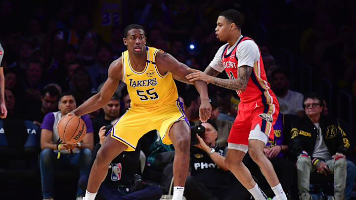 Mar 4, 2025; Los Angeles, California, USA; Los Angeles Lakers center Trey Jemison III (55) moves the ball against New Orleans Pelicans guard Jordan Hawkins (24) during the second half at Crypto.com Arena. Mandatory Credit: Gary A. Vasquez-Imagn Images