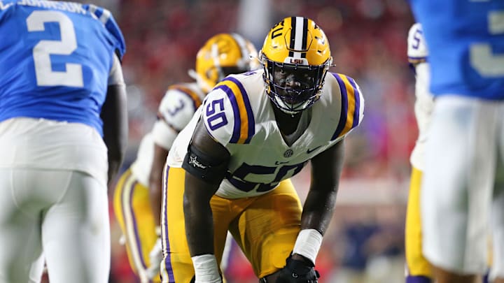 Sep 30, 2023; Oxford, Mississippi, USA; LSU Tigers offensive linemen Emery Jones Jr. (50) lines up prior to the snap during the second half against the Mississippi Rebels at Vaught-Hemingway Stadium. Mandatory Credit: Petre Thomas-Imagn Images