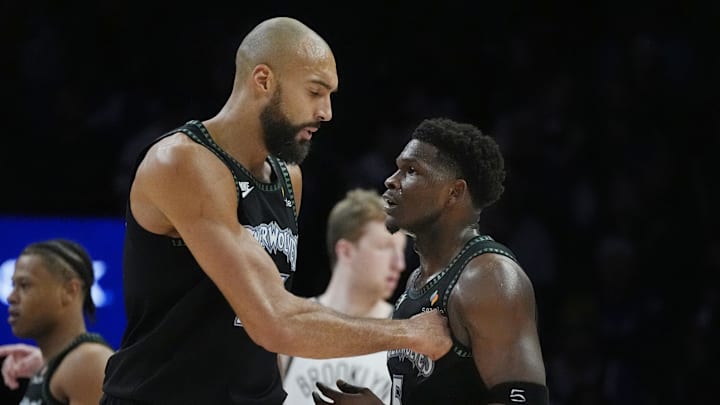 Dec 27, 2025; Minneapolis, Minnesota, USA; Minnesota Timberwolves center Rudy Gobert (27) congratulates guard Anthony Edwards (5) on his basket against the Brooklyn Nets in the first quarter at Target Center. Mandatory Credit: Bruce Kluckhohn-Imagn Images